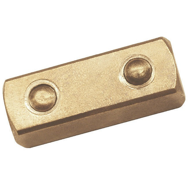 Cuadradillo pasante 1/2" ATEX: Bloque metálico rectangular con dos remaches redondos en la superficie